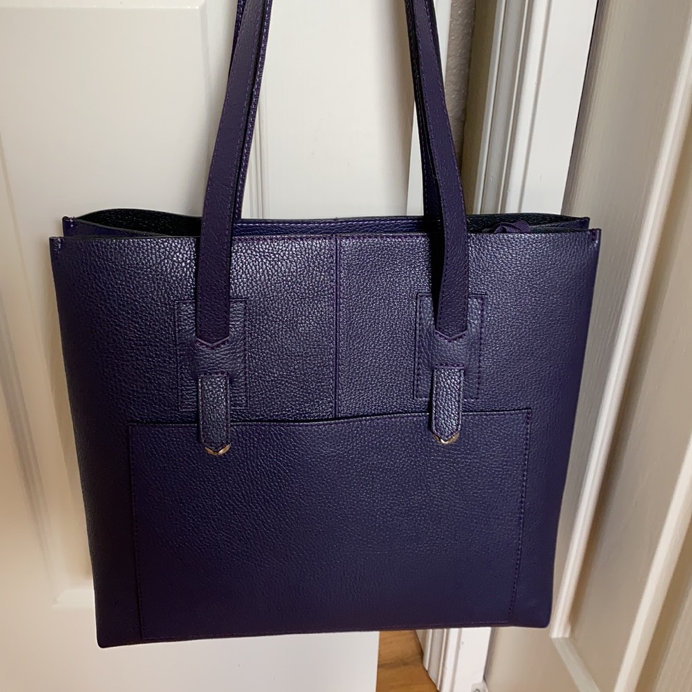 Plum-colored Isabella Rhea tall handbag.